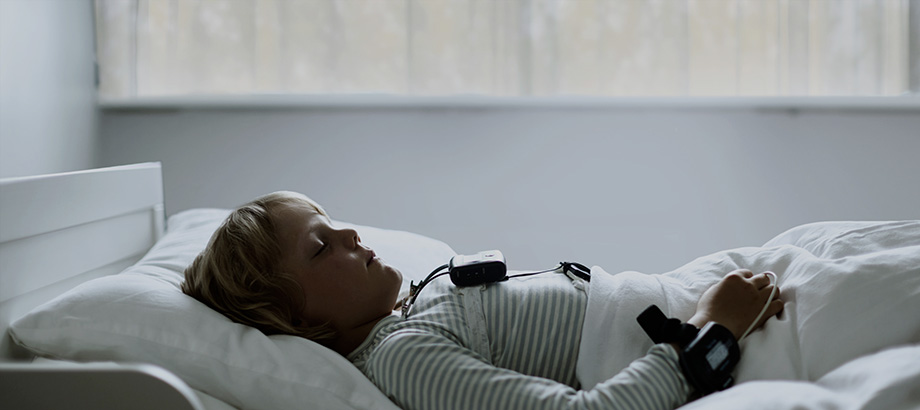 Child wearing the Nox T3 home sleep study device — suitable from 2 years old